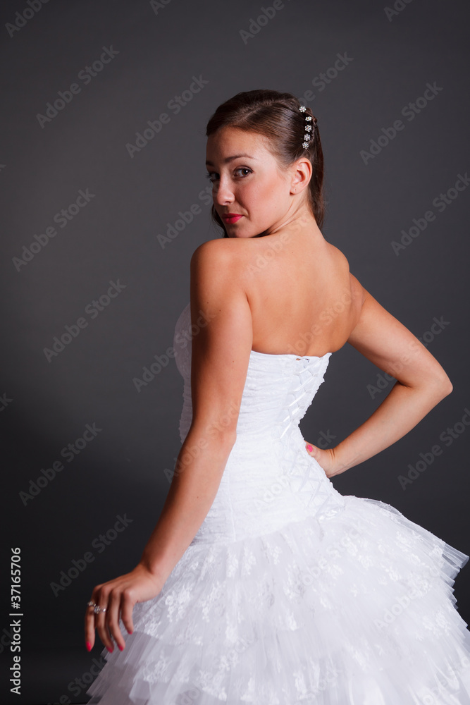 Beautiful dark haired woman in white bridal dress Beautiful dark haired woman in white bridal dress
