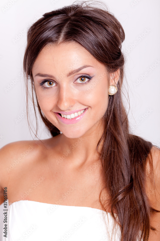Beautiful dark haired woman in white bridal dress
