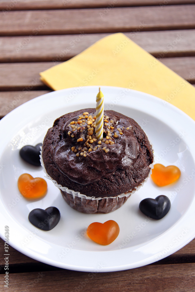 schokomuffin mit kerze Stock Photo | Adobe Stock