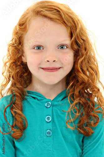 Close Up Girl Child with Orange Curly Hair and Blue Eyes photo