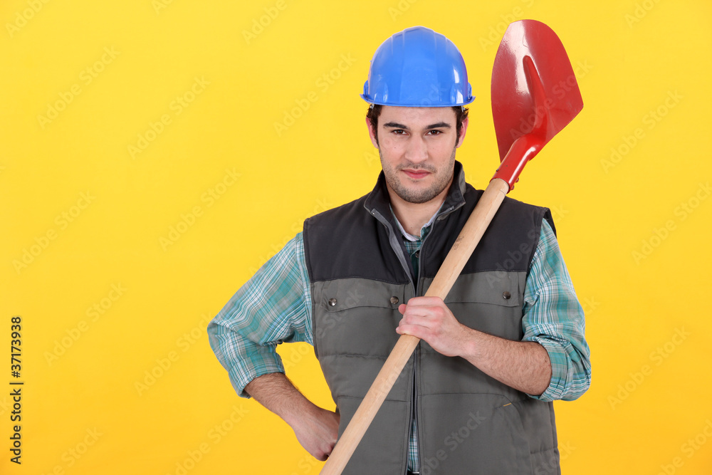 Builder stood with spade
