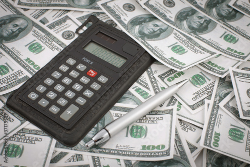 money calculator and pen background photo
