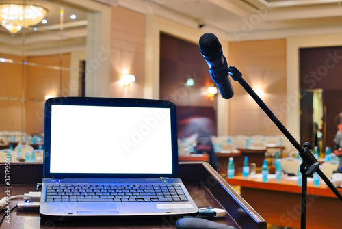 the rostrum with notebook waiting for a speaker