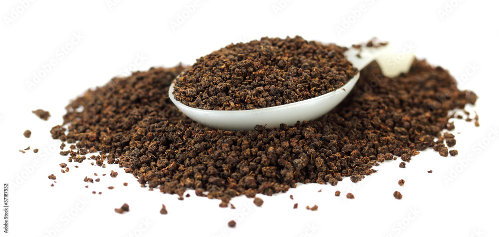 Black tea granules with spoon Black tea granules with spoon