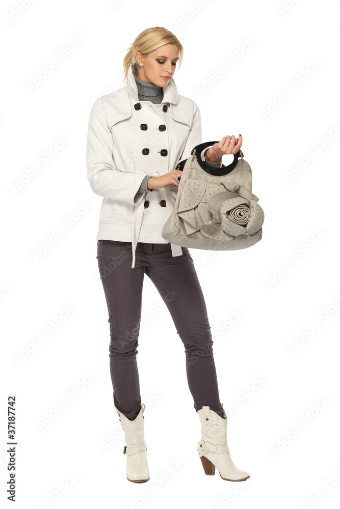 Fototapeta premium beautiful young woman looking for something in her bag