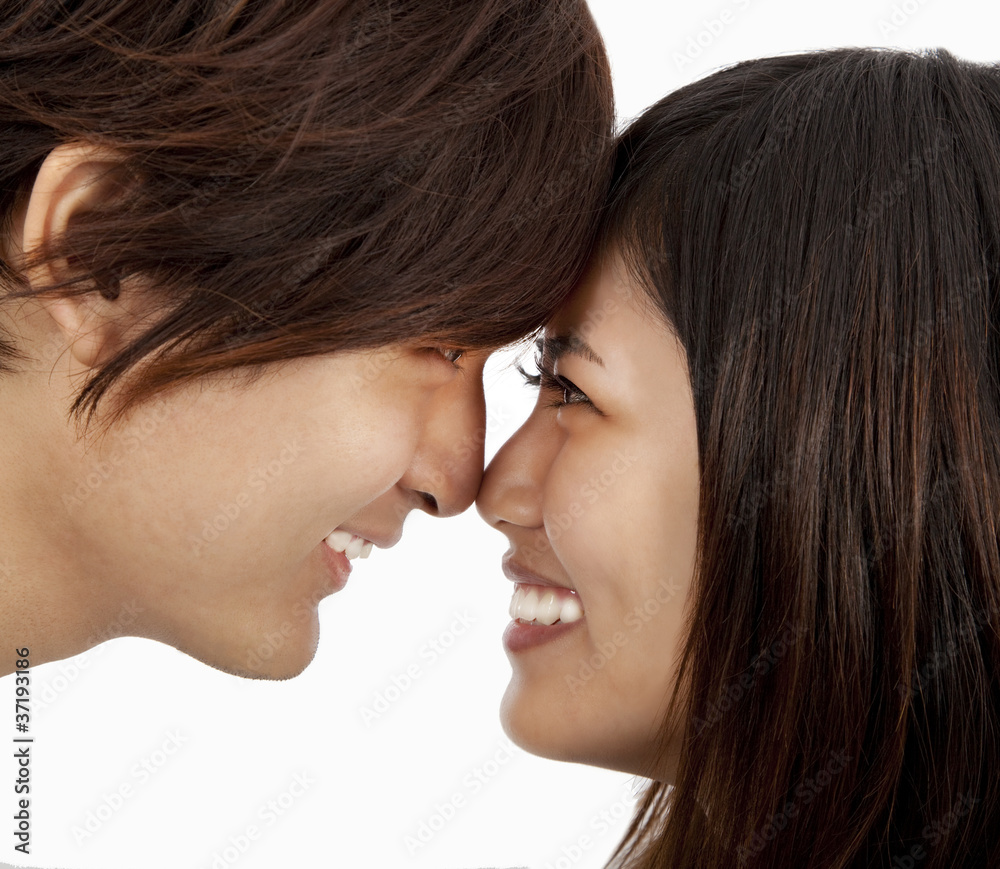 asian couple face to face and isolated on white asian couple face to face and isolated on white