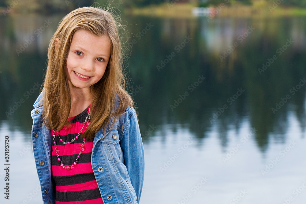 cute kid at a lake