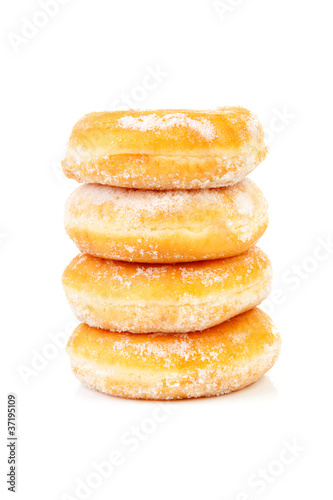four stacked sugared delicious donuts