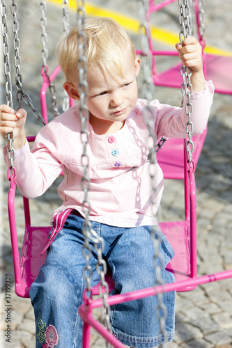 little girl on carousel photo