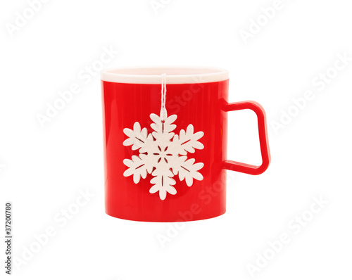 Red plastic cup and snowflake isolated on white