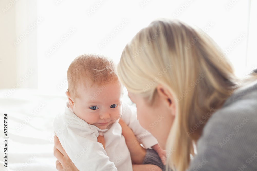 Mother taking care of her newborn Mother taking care of her newborn