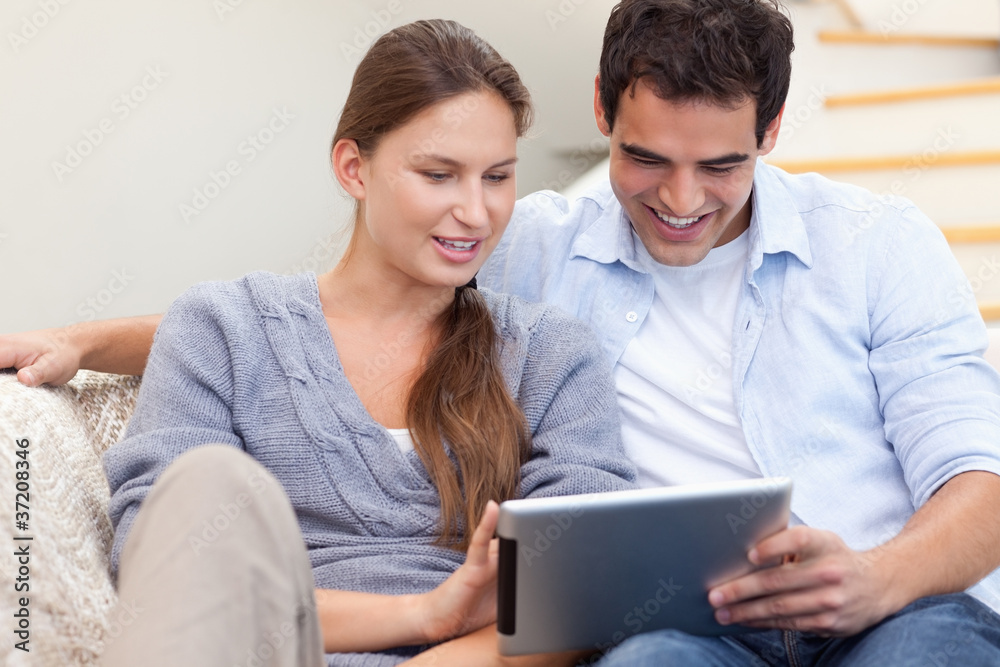 Couple using a tablet computer Couple using a tablet computer