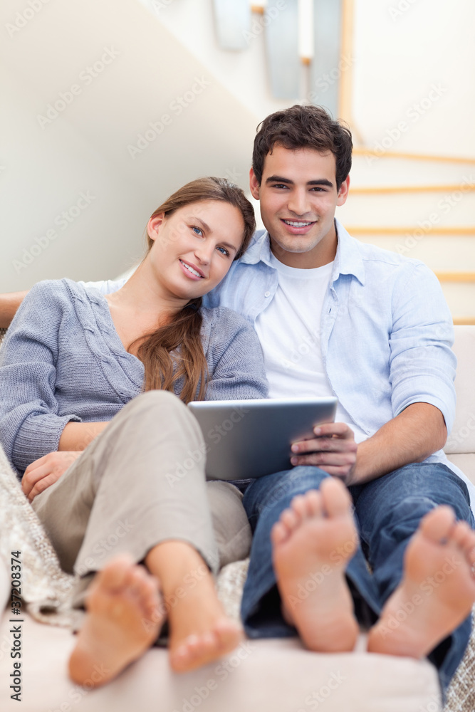 Portrait of a young couple using a tablet computer Portrait of a young couple using a tablet computer