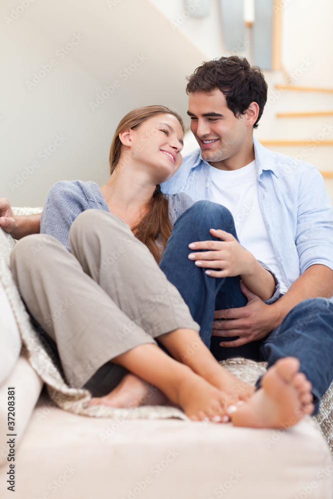Portrait of a couple lying on a couch Portrait of a couple lying on a couch