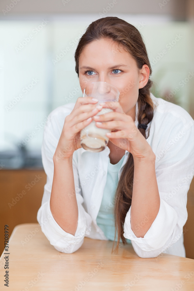 Portrait of a happy woman drinking milk Portrait of a happy woman drinking milk