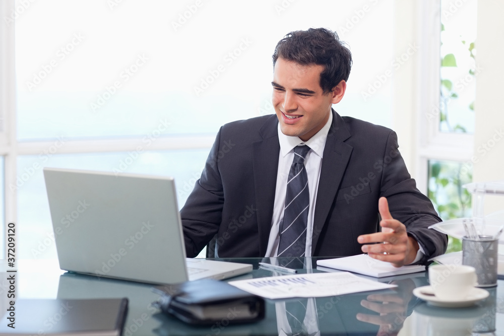 Upset businessman during a video conference Upset businessman during a video conference
