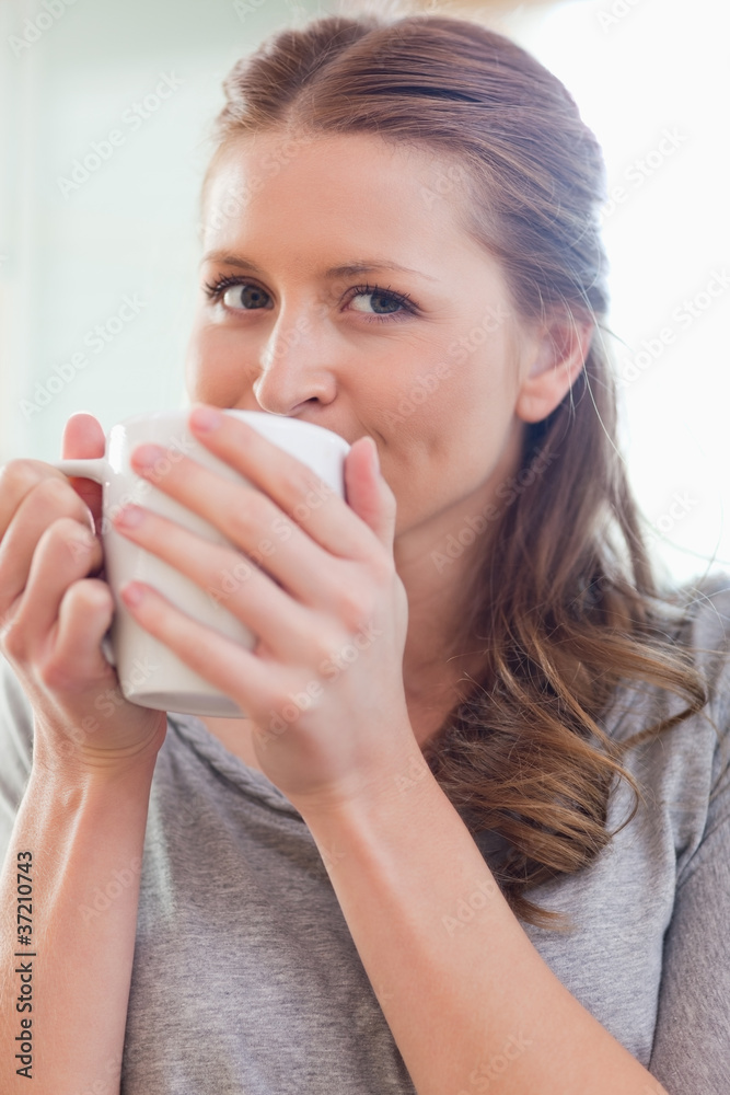 Close up of woman enjoying coffee Close up of woman enjoying coffee