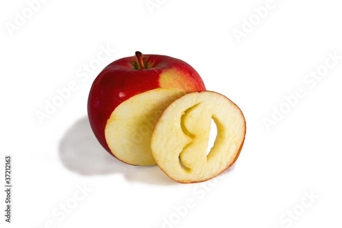 bright red apple and cut into a laughing smiley face carved from