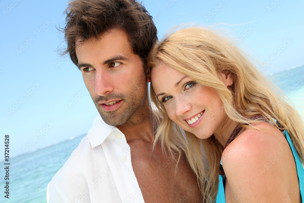 Portrait of in loved couple on beach holidays Portrait of in loved couple on beach holidays