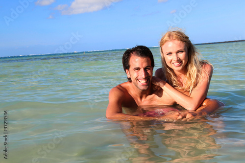 Couple having fun at the beach © goodluz