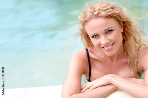 Beautiful blond woman in swimming pool