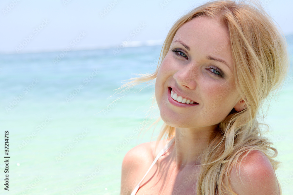 Beautiful blond woman in ocean water