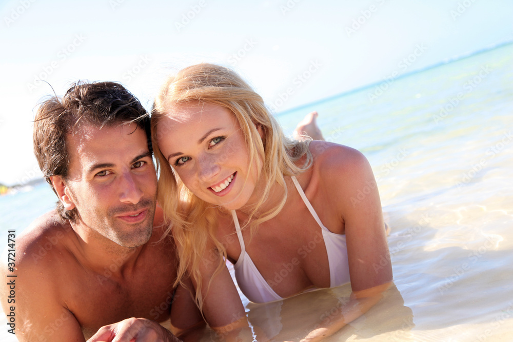 Just married couple bathing in crystal clear water