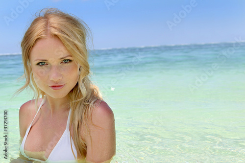 Beautiful blond woman in ocean water