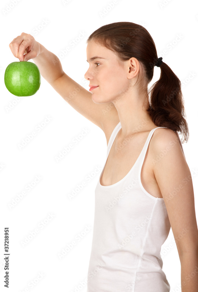 Green apple in smiling girl's hand Green apple in smiling girl's hand