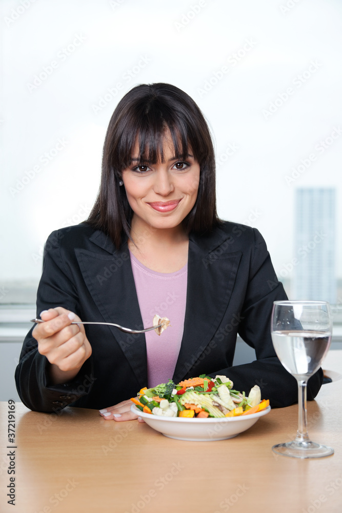 Female Executive Eating Fresh Vegetable Salad Female Executive Eating Fresh Vegetable Salad