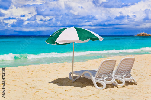 Chairs and umbrella at tropical beach