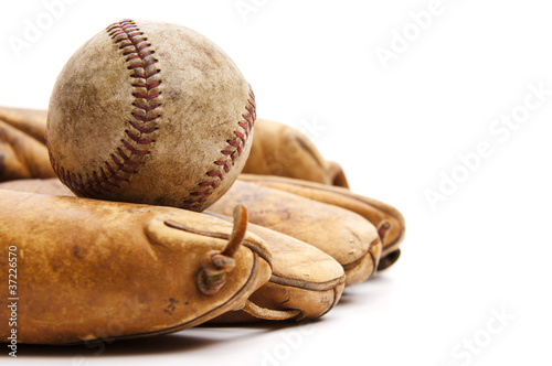 Vintage baseball glove and ball isolated on white