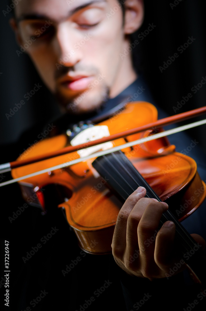 Violin player playing the intstrument Violin player playing the intstrument