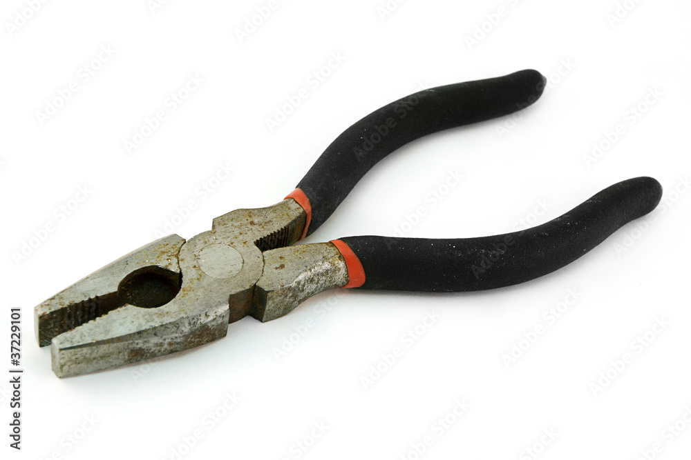 Obraz premium Old rusty pliers over white