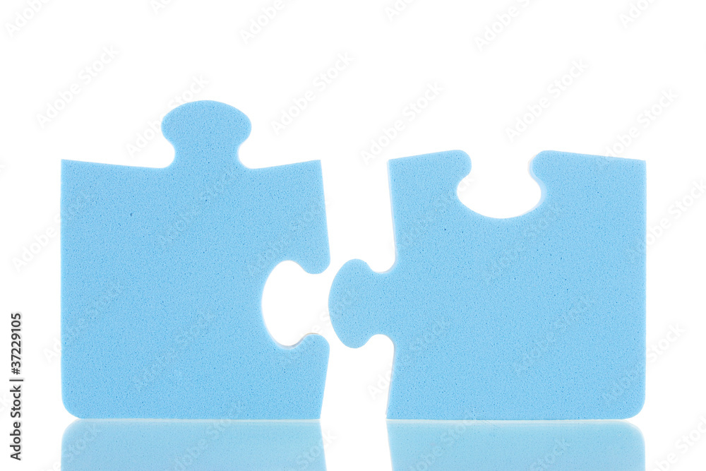 Blue puzzles closeup, isolated on white Blue puzzles closeup, isolated on white