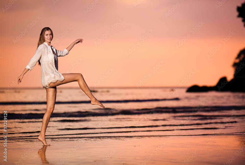 woman on the sunset beach