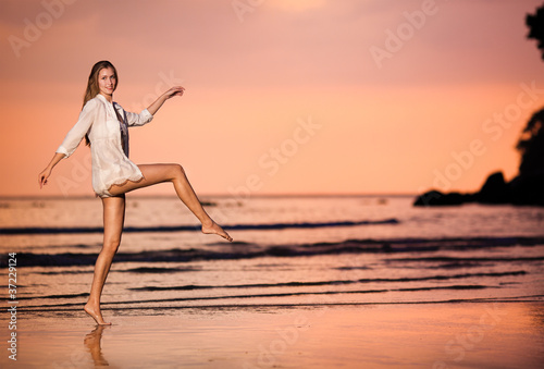 woman on the sunset beach