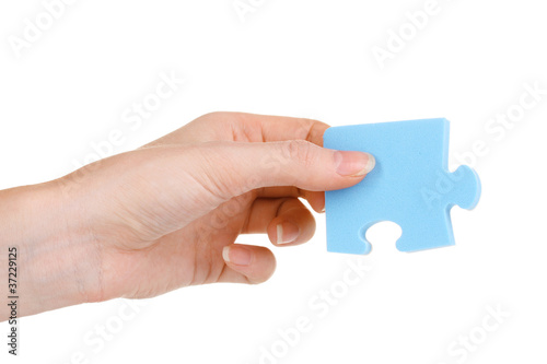 Hand and puzzle, isolated on white