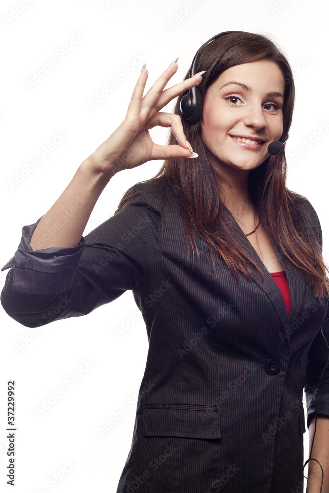 Woman operator with headset showing hand ok sign Woman operator with headset showing hand ok sign