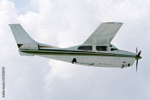 Small tourist plane over Caribbean beach in Mexico