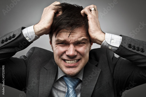 Canvas-taulu Businessman pulling his hair