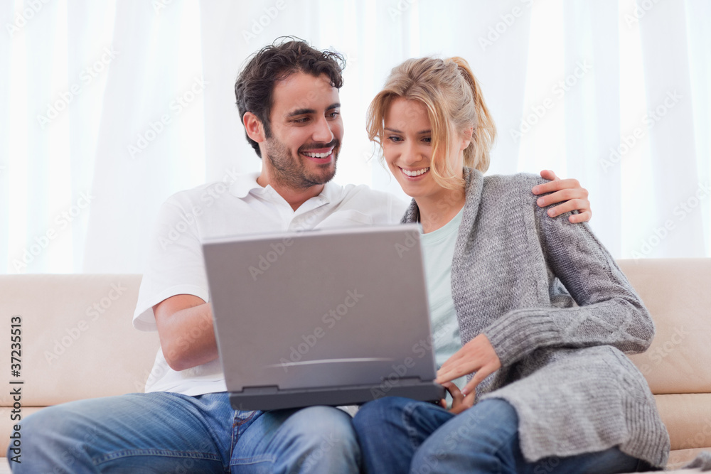 Couple using a notebook