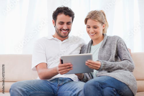 Couple using a tablet computer