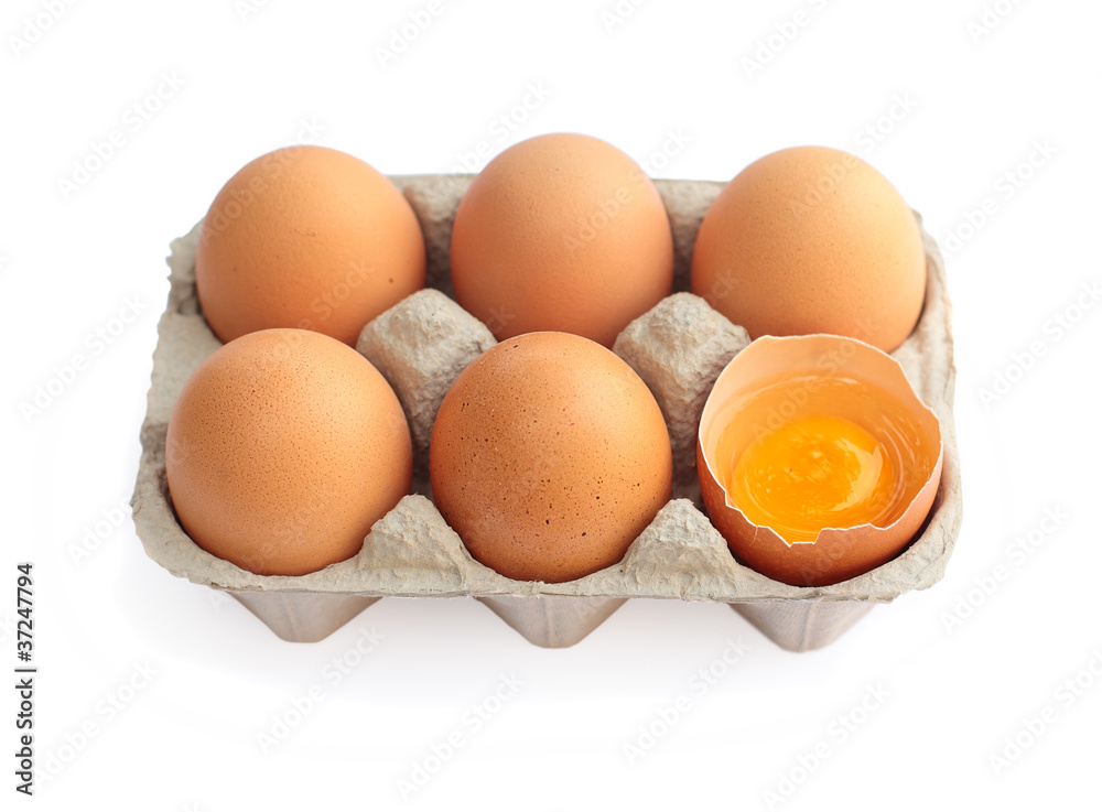 Eggs in cardboard container isolated on white background Eggs in cardboard container isolated on white background