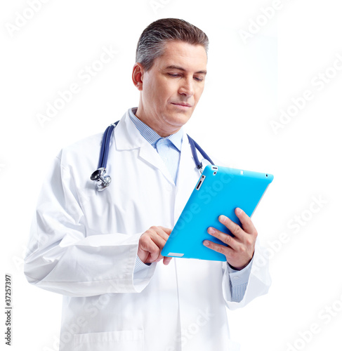 Smiling doctor with tablet computer.