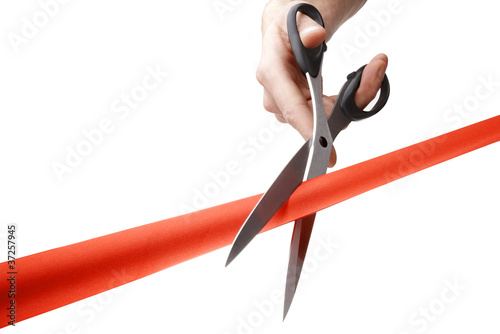 cutting a red ribbon