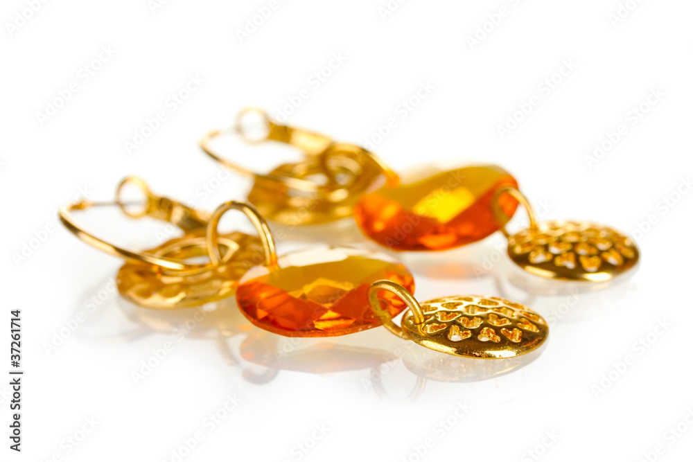 Earrings with yellow stone isolated on the white Earrings with yellow stone isolated on the white