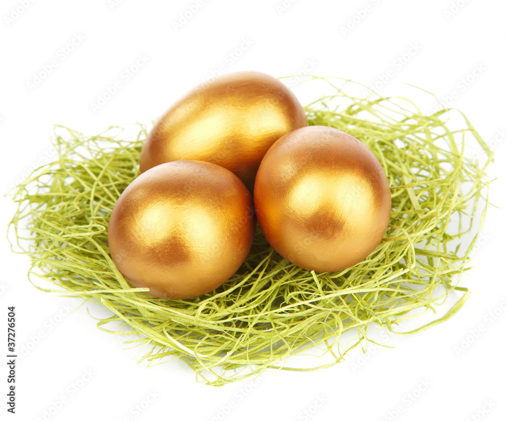 golden easter eggs in nest isolated golden easter eggs in nest isolated