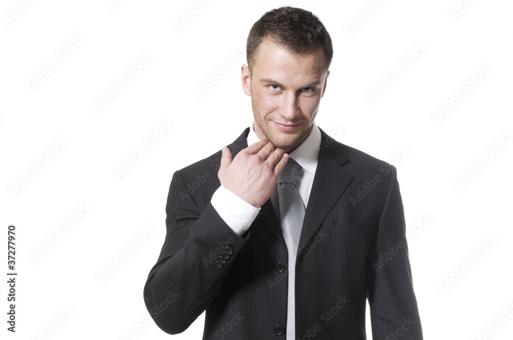 Handsome young businessman in black suit and grey necktie Handsome young businessman in black suit and grey necktie