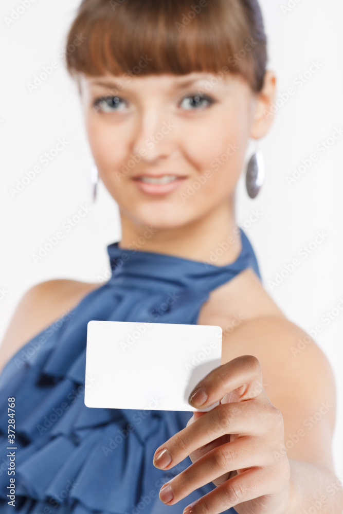 Young beautiful girl shows a business card Young beautiful girl shows a business card